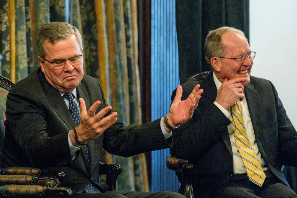 Former Florida Gov. Jeb Bush gestures during an education forum in Nashville, Tenn., on Wednesday, March 19, 2014 with U.S. Sen. Lamar Alexander (R-Tenn). (AP Photos/Erik Schelzig)