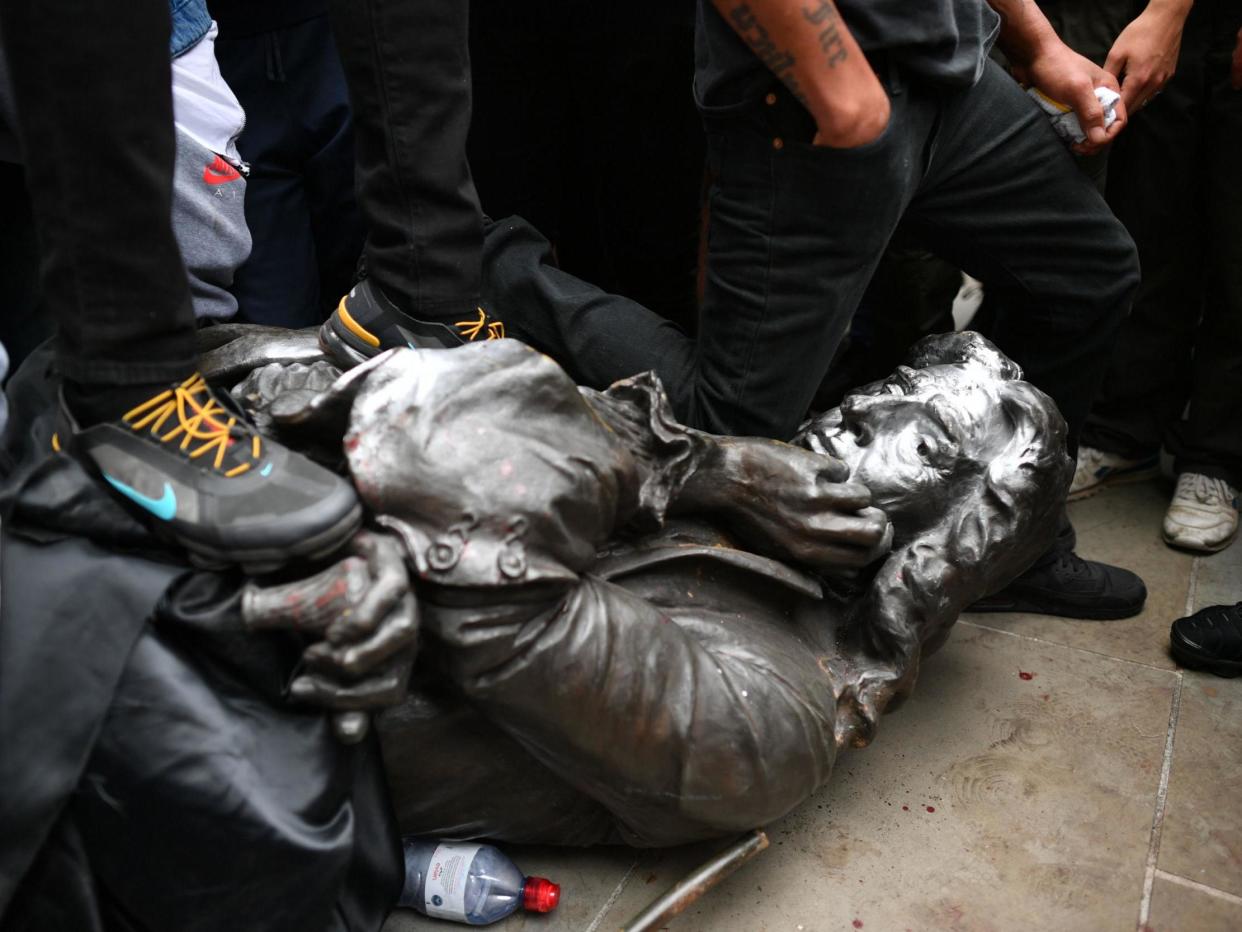 Protesters pull down a statue of Edward Colston during a Black Lives Matter protest rally in College Green, Bristol: Ben Birchall/PA