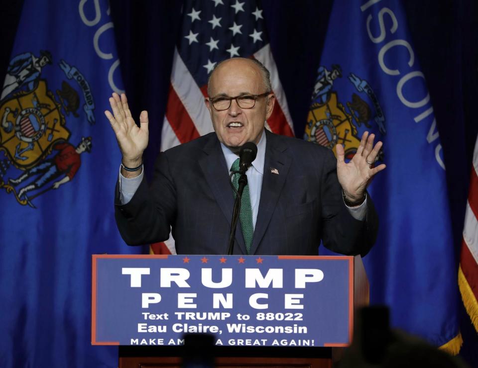 FILE- In this Nov. 1, 2016 file photo, former New York City Mayor Rudy Giuliani campaigns for Republican presidential candidate Donald Trump at the University of Wisconsin Eau Claire in Eau Claire, Wis. On Friday, Dec. 9, 2016, President-elect Donald Trump announced that Giuliani has taken his name out of the running for a cabinet position in the Trump administration. (AP Photo/Matt Rourke)