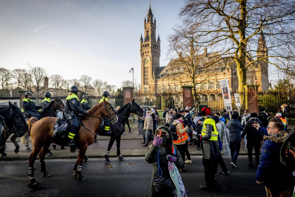 Police officers disperse protestors during a demonstration in support of Palestinians during a hearing at the International Court of Justice (ICJ) on a genocide complaint by South Africa against Israel, in The Hague, on Jan. 11, 2024.