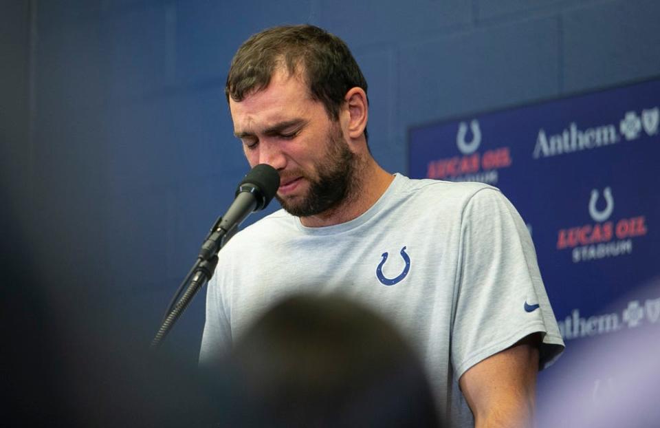 Andrew Luck breaks down during a press conference announcing his retirement at Lucas Oil Stadium, August 24, 2019.