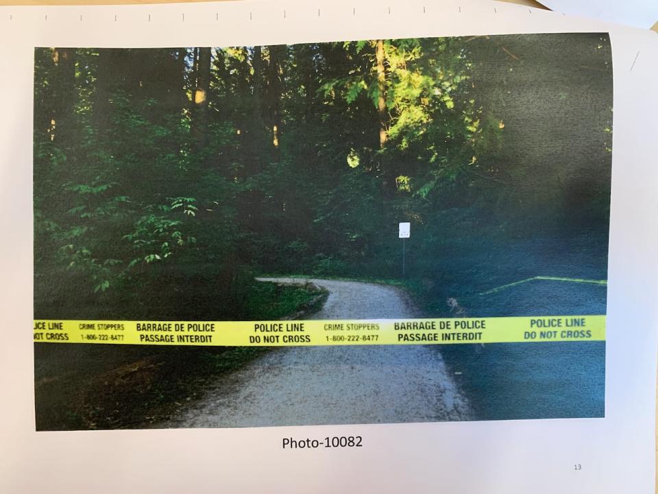 Police tape is strung across a path in Burnaby's Central Park, where a teenager's body was found on July 19, 2017.
