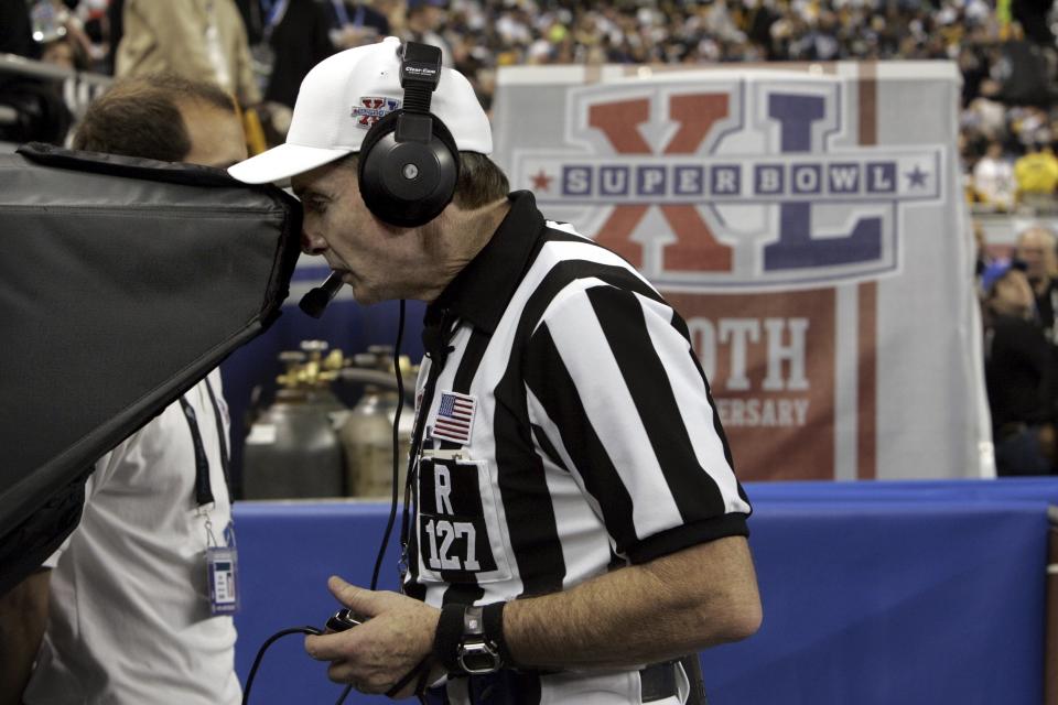 FILE - Referee Bill Leavy reviews a play after Pittsburgh Steelers quarterback Ben Roethlisberger's one-yard dive was called a touchdown during the second quarter of play against the Seattle Seahawks at the Super Bowl XL football game, Sunday, Feb. 5, 2006, in Detroit. The call stood as a touchdown. (AP Photo/Paul Sancya, File)