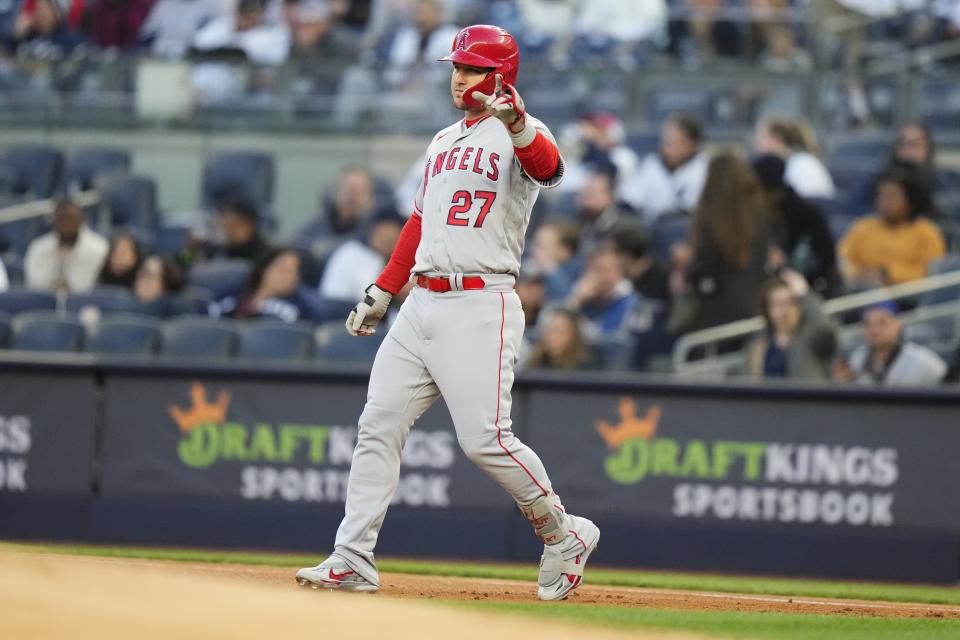 Los Angeles Angels' Mike Trout gestures after hitting a single during the first inning of the team's baseball game against the New York Yankees on Tuesday, April 18, 2023, in New York. (AP Photo/Frank Franklin II)