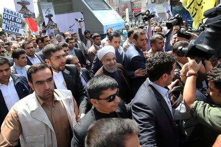 Iran's President Hassan Rouhani arrives to a rally marking the international al-Quds day in support of the Palestinians, in Tehran, Iran July 1, 2016. President.ir/Handout via REUTERS