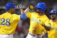 Boston Red Sox's Xander Bogaerts, right, is congratulated by J.D. Martinez (28) after his two-run home run in the fifth inning of a baseball game against the New York Mets at Fenway Park, Tuesday, Sept. 21, 2021, in Boston. (AP Photo/Charles Krupa)