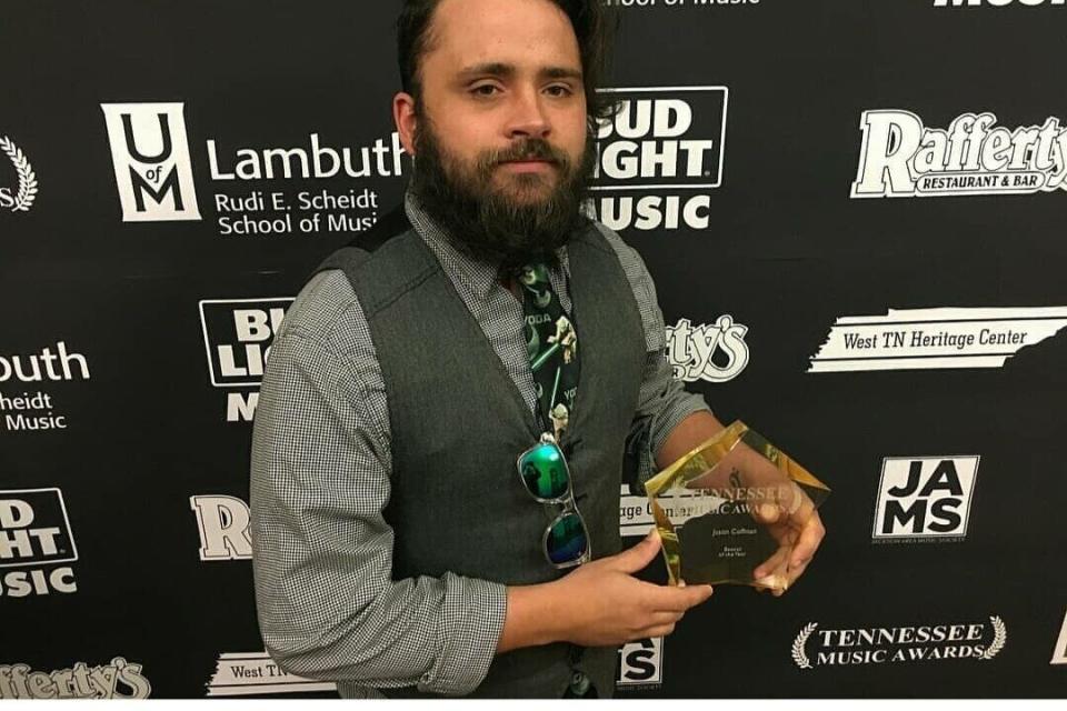 Justin Coffman with his award as bassist of the year in Tennessee. (Photo: Courtesy of Leah Harris)