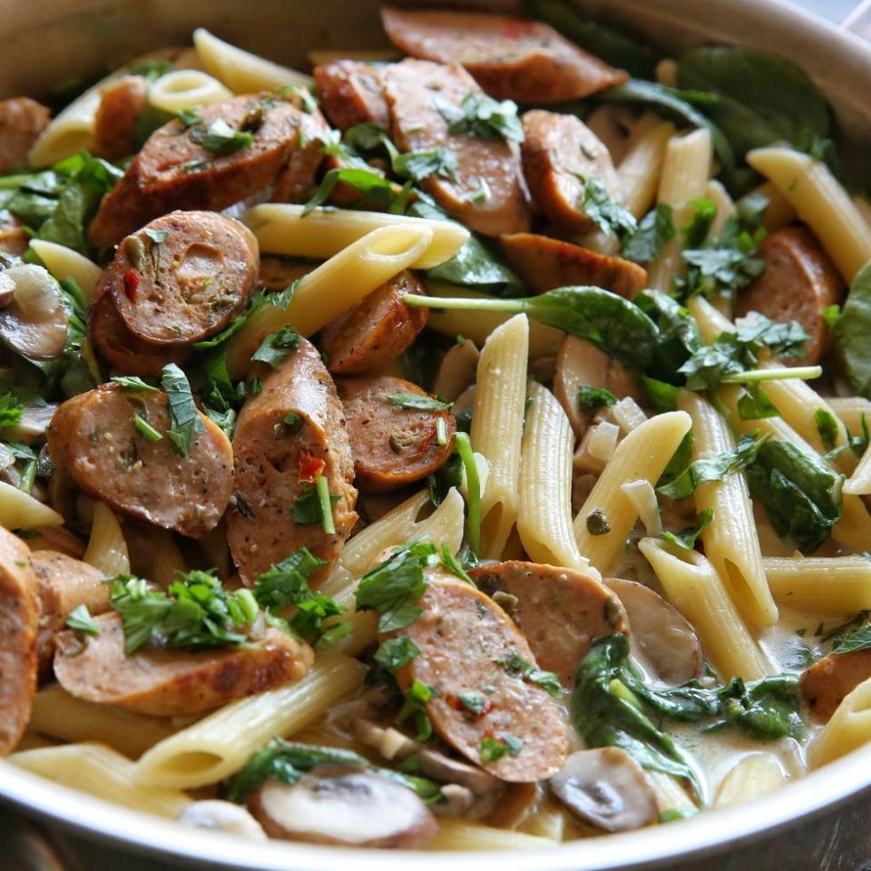 <p>Creamy, garlicky pasta is what dreams are made of. This recipe calls for chicken sausage, but opt for pork sausages if you prefer. If using pork sausages, make sure they're cooked properly (around 10-12 minutes in the pan). </p><p>Get the <a href="https://www.delish.com/uk/cooking/recipes/a29571352/chicken-sausage-and-mushroom-penne-recipe/" rel="nofollow noopener" target="_blank" data-ylk="slk:Sausage and Mushroom Penne;elm:context_link;itc:0;sec:content-canvas" class="link ">Sausage and Mushroom Penne</a> recipe.</p>