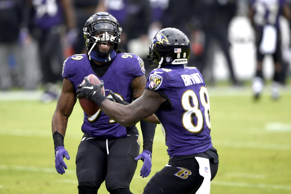 Baltimore Ravens wide receiver Dez Bryant (88) celebrates his touchdown catch against the Jacksonville Jaguars with linebacker Matthew Judon (99) during the first half of an NFL football game, Sunday, Dec. 20, 2020, in Baltimore. (AP Photo/Gail Burton)