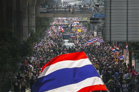 Anti-government protesters take part in a rally in central Bangkok January 30, 2014. REUTERS/Athit Perawongmetha