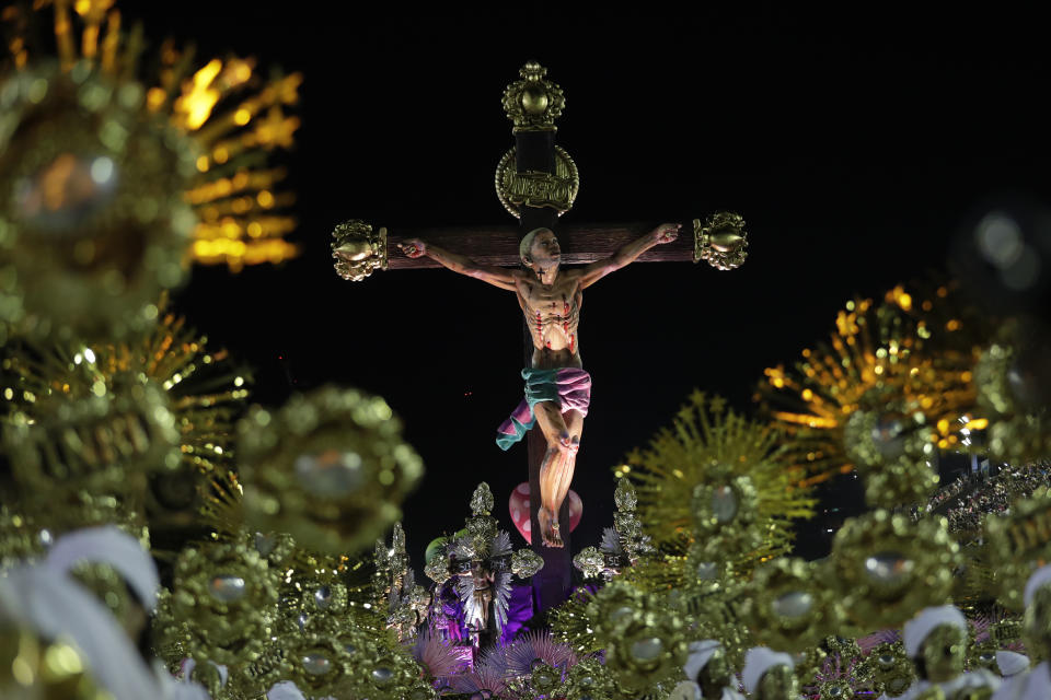 Performers from the Mangueira samba school parade during Carnival celebrations at the Sambadrome in Rio de Janeiro, Brazil, Monday, Feb. 24, 2020. (AP Photo/Silvia Izquierdo)