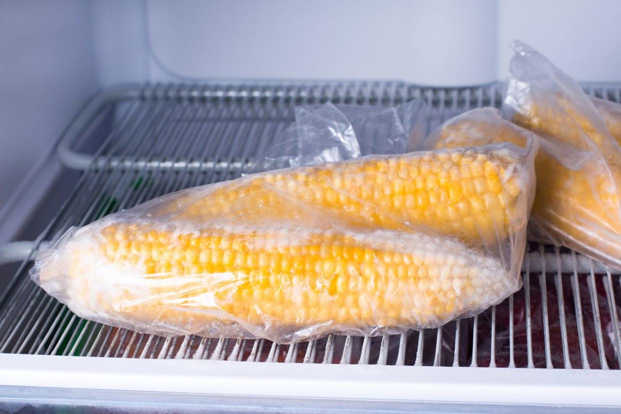 frozen corn in bag in freezer close up