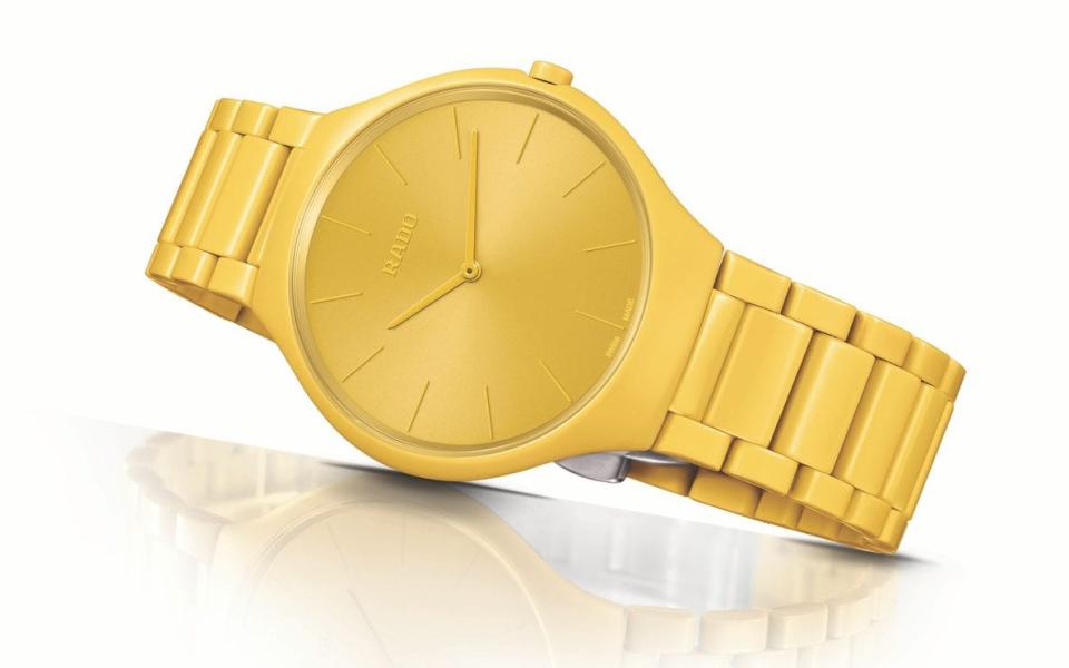 A yellow model from the True Thinline Les Couleurs Le Corbusier collection by Rado 