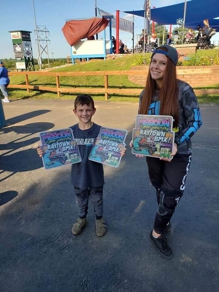 Brysen Bolger with his mother, Kuri, after a BMX race in 2021.