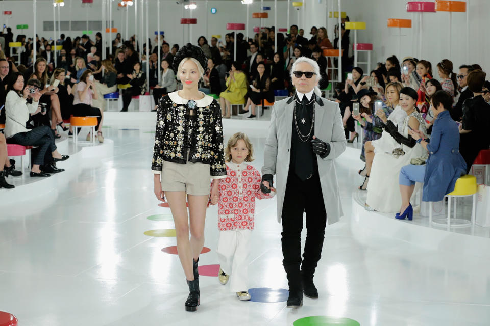 To close out the South Korea show, Karl Lagerfeld walked the Twister-inspired runway with his godson Hudson Kroenig in hand and model Soo Joo accompanying them.