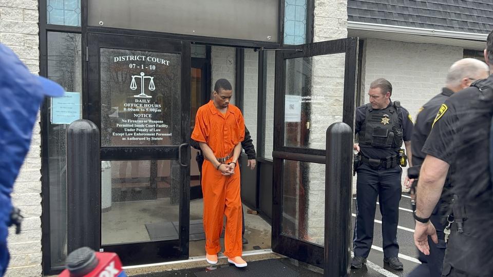 Andre Gordon Jr., who faces first-degree murder charges in the shooting deaths of his stepmother, sister and the mother of his children, exits the Bucks County court after appearing for a preliminary hearing, Wednesday, April 3, 2024, in Fallsington, Pa. The judge denied bail and the district attorney said she would seek the death penalty. Asked if he had any comment, Gordon said "Pray, pray to God." (AP photo/Mike Catalini)