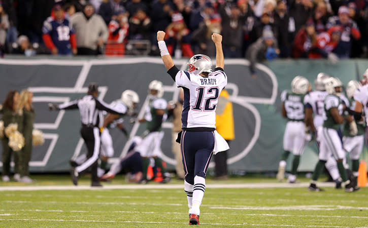 Nov 27, 2016; East Rutherford, NJ, USA; New England Patriots quarterback Tom Brady (12) reacts against the New York Jets during the fourth quarter at MetLife Stadium.