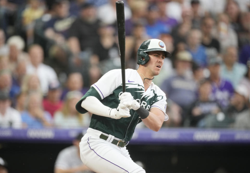 Colorado Rockies' Nolan Jones watches his two-run single off Chicago White Sox starting pitcher Jesse Scholtens during the second inning of a baseball game Saturday, Aug. 19, 2023, in Denver. (AP Photo/David Zalubowski)