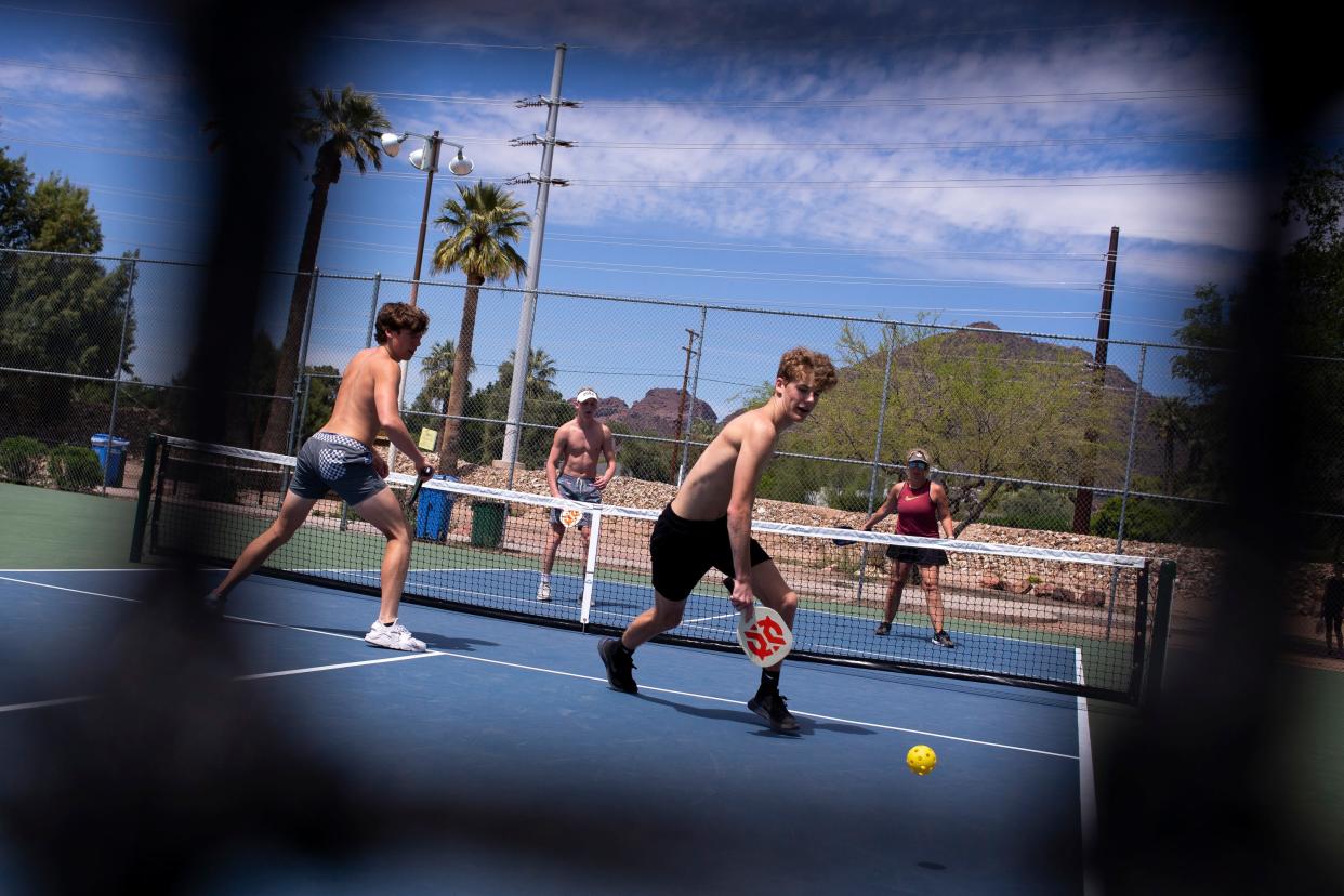 Kellen Flanigan (left) and Hudson Buth play pickleball with Riley Buth and Colleen Flanigan on April 1, 2020, at G.R. Herberger Park in Phoenix.