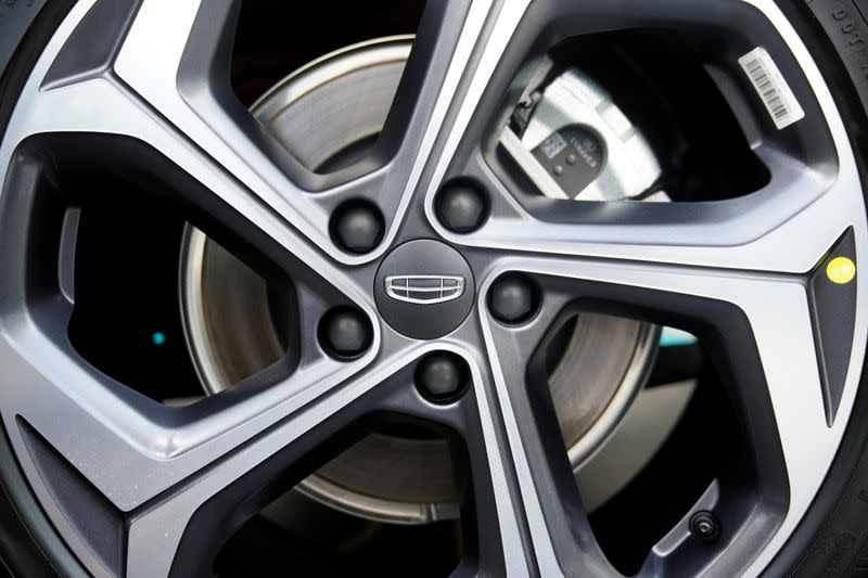 The Geely logo is seen on a rim at a car dealership in Shanghai