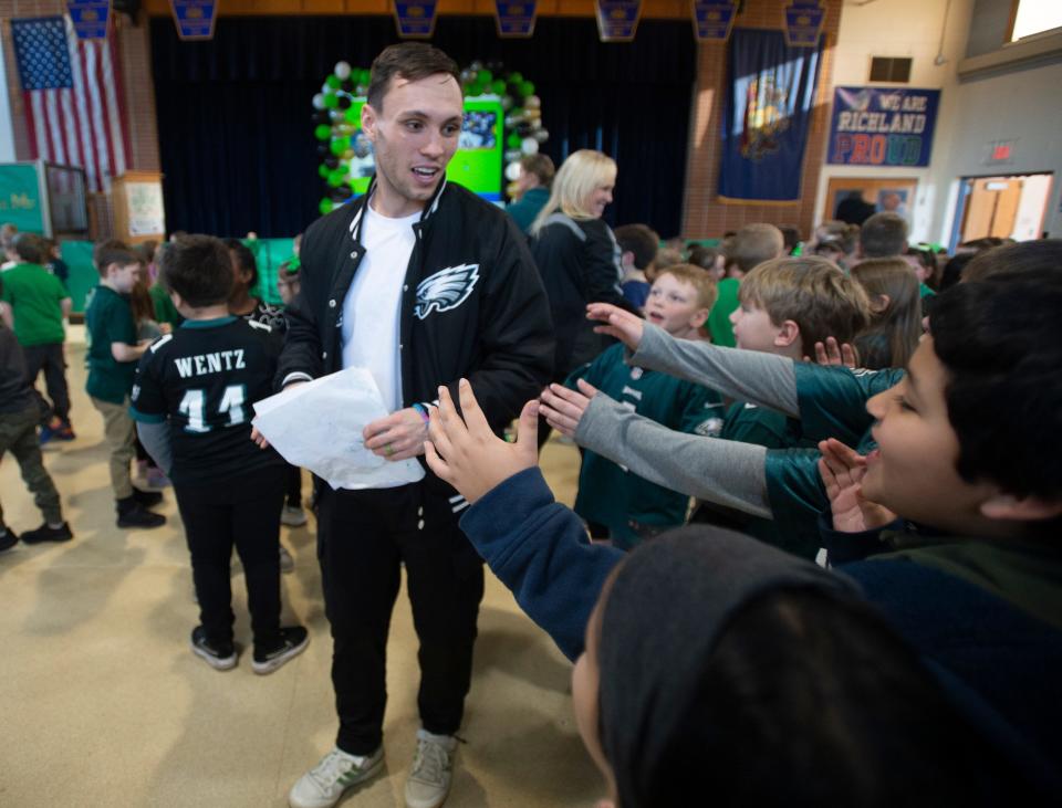 Eagles punt returner Britain Covey walks by Richland Elementary students Wednesday, Feb. 1, 2023, during a visit to the school in Richland Township.  Covey answered questions from students ahead of the team's Super Bowl appearance against the Kansas City Chiefs.