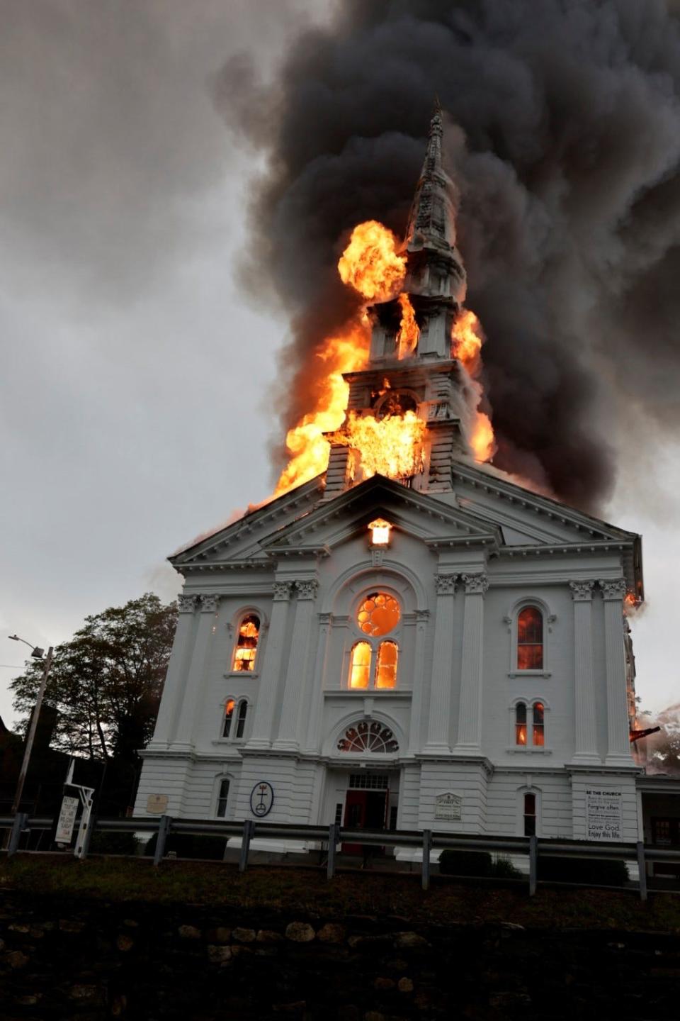 Flames filled the church and enveloped the steeple, which eventually toppled.