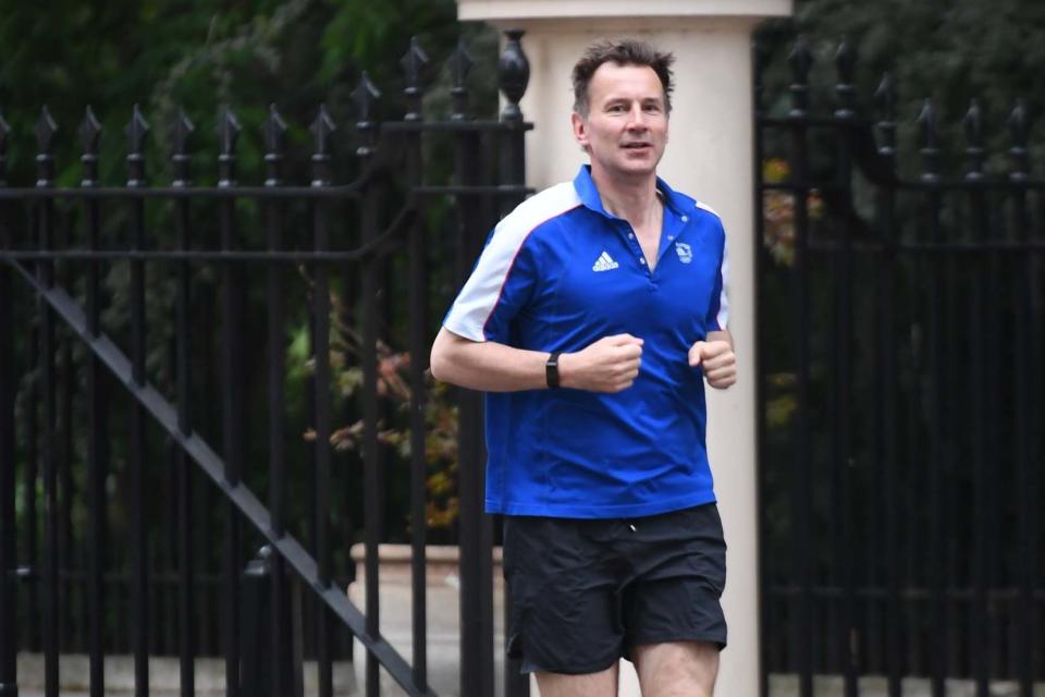 Still in the running: Jeremy Hunt out jogging today (Jeremy Selwyn / Evening Standard)