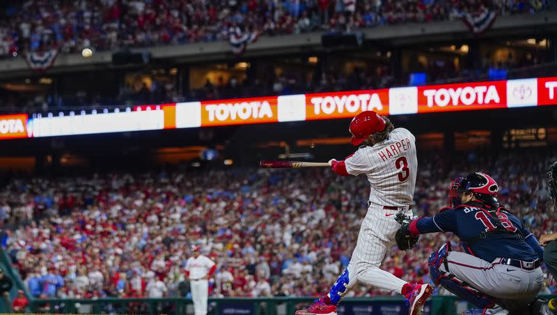 Philadelphia Phillies’ Bryce Harper hits a home run during the fifth inning of Game 3 of a baseball NL Division Series against the Atlanta Braves on Wednesday, Oct. 11, 2023, in Philadelphia.
