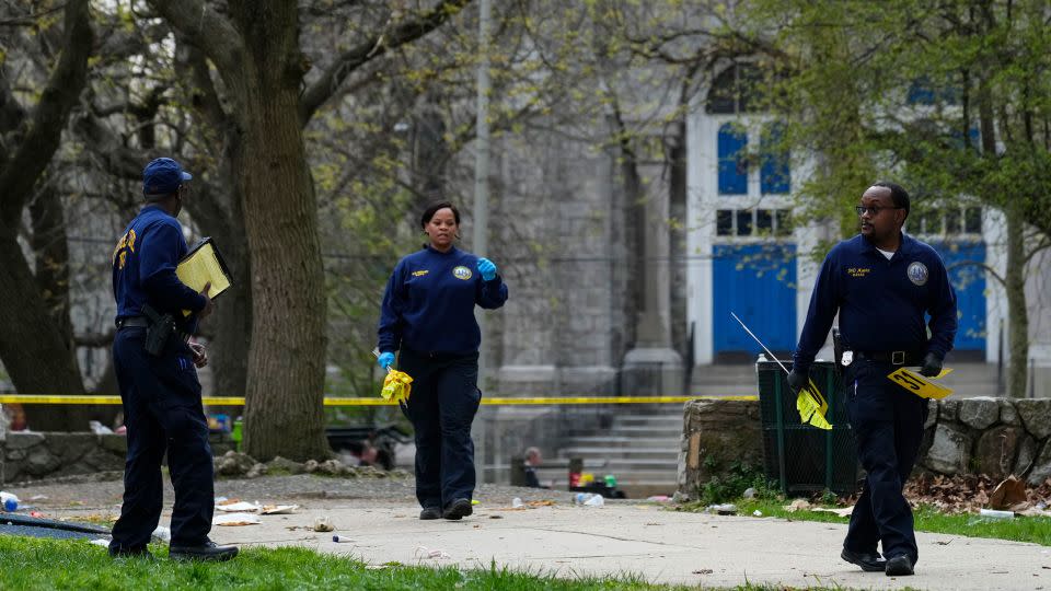 Investigators work the scene of the shooting in Philadelphia, Wednesday, April 10, 2024. - Matt Rourke/AP