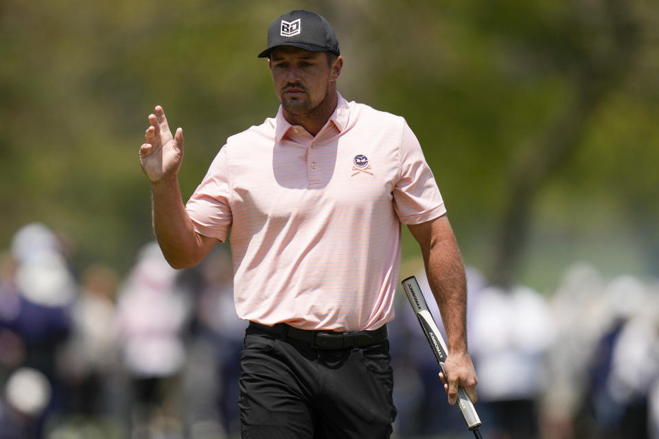 Bryson DeChambeau waves after his putt on the 15th hole during the first round of the PGA Championship golf tournament at Oak Hill Country Club on Thursday, May 18, 2023, in Pittsford, N.Y. (AP Photo/Seth Wenig)