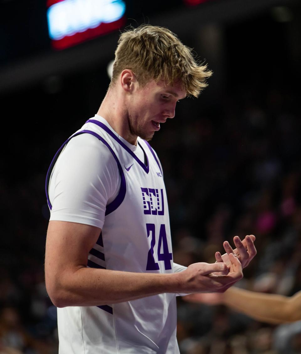 Grand Canyon Lopes forward Duke Brennan (24) looks at his hands after falling at Grand Canyon University Arena in Phoenix on Jan. 11, 2024.