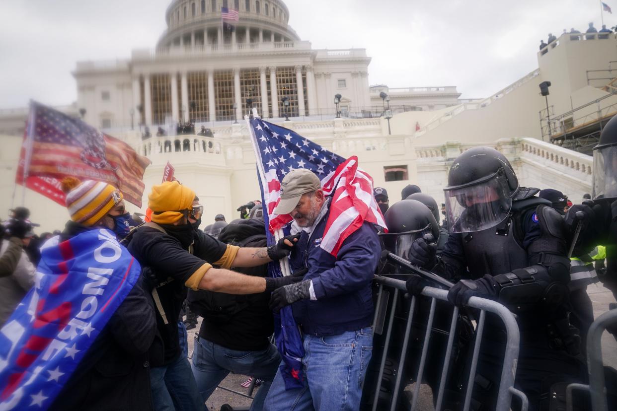 <p>At least 13 off-duty law enforcement officers are suspected of being part of the mob that overtook the Capitol.</p> (AP)