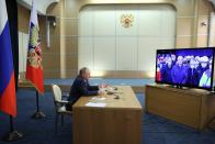 Russian President Vladimir Putin takes part in a ceremony to open ten new stations of the Big Circle Line of the Moscow subway via videoconference at the Bocharov Ruchei residence in the Black Sea resort of Sochi, Russia, Tuesday, Dec. 7, 2021. The Big Circle Line is scheduled to be completed in late 2022. (Mikhail Metzel, Sputnik, Kremlin Pool Photo via AP)