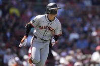 San Francisco Giants' Jung Hoo Lee watches his fly out to center during the third inning of a baseball game against the Boston Red Sox at Fenway Park, Thursday, May 2, 2024, in Boston. (AP Photo/Charles Krupa)