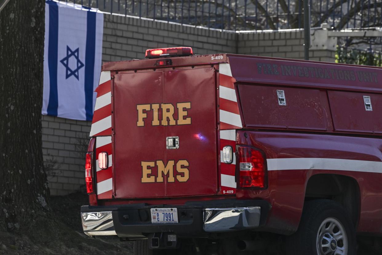 <span>Police investigate after a man set himself on fire in front of the Israeli embassy in Washington DC on 25 February.</span><span>Photograph: Celal Gunes/Anadolu via Getty Images</span>