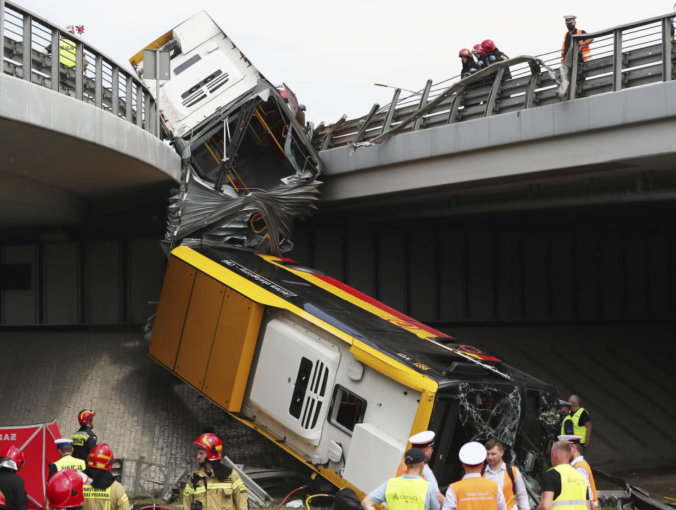 The wreckage of a Warsaw city bus is shown after the articulated bus crashed off an overpass, killing one person and injuring about 20 people, in Warsaw, Poland, on June 25, 2020. The accident forced Warsaw Mayor Rafal Trzaskowski, who is a runner-up candidate in Sunday presidential election, to suspend his campaigning.(AP Photo/Czarek Sokolowski)