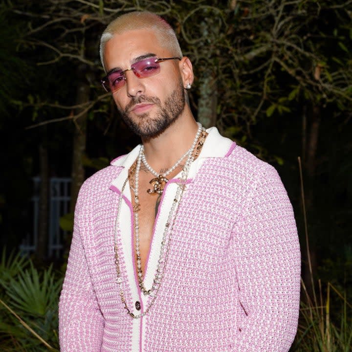 Maluma in a knit cardigan and matching pants at an event