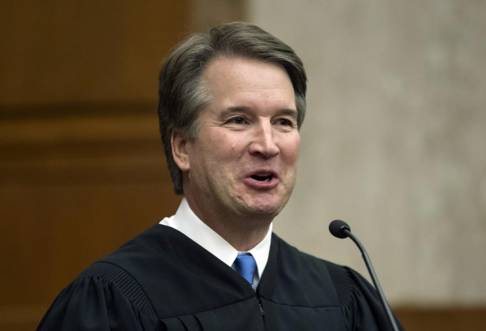 In this Aug. 7, 2018, photo. President Donald Trump's Supreme Court nominee, Judge Brett Kavanaugh, officiates at the swearing-in of Judge Britt Grant to take a seat on the U.S. Court of Appeals for the Eleventh Circuit in Atlanta at the U.S. District Courthouse in Washington. America is about to get its first extended look at Supreme Court nominee Brett Kavanaugh in his confirmation hearing before the Senate Judiciary Committee. (AP Photo/J. Scott Applewhite)