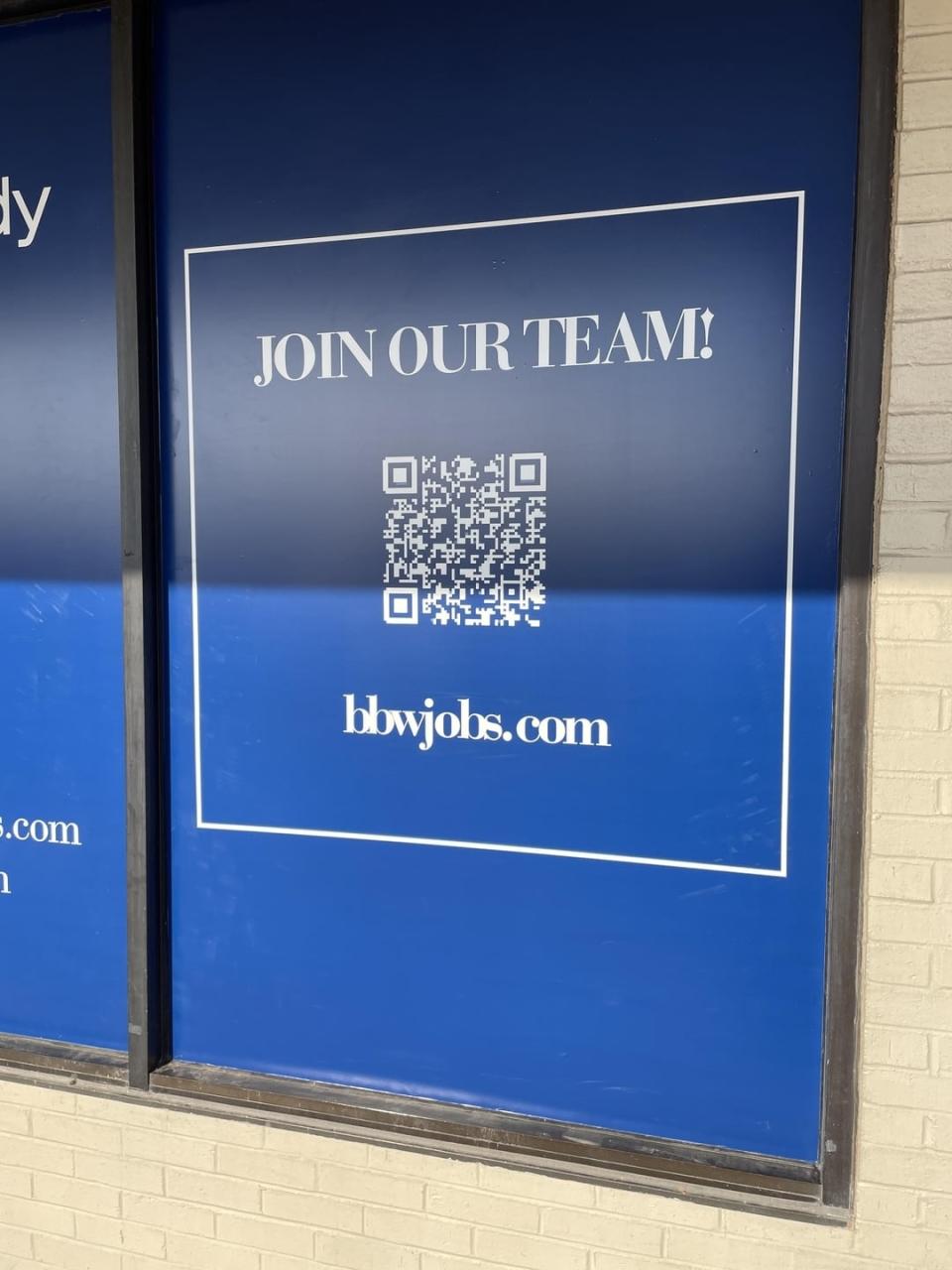 A blue sign with "Join our team!" and a QR code. The website bbwjobs.com is displayed at the bottom, but it looks like "blowjobs.com"