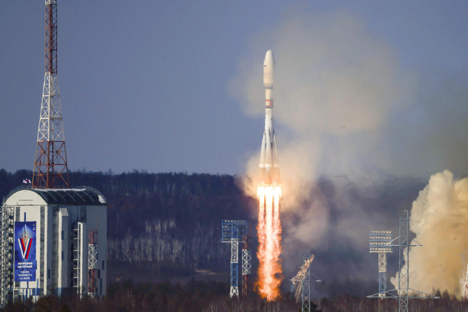 In this photo released by Roscosmos space corporation on Thursday, Feb. 29, 2024, the Soyuz-2.1b rocket blasts off at the Vostochny cosmodrome outside the city of Tsiolkovsky, about 200 kilometers (125 miles) from the city of Blagoveshchensk in the far eastern Amur region, Russia. A Russian Soyuz rocket successfully put an Iranian satellite into orbit along with 18 Russian satellites on Thursday. (Roscosmos space corporation via AP)
