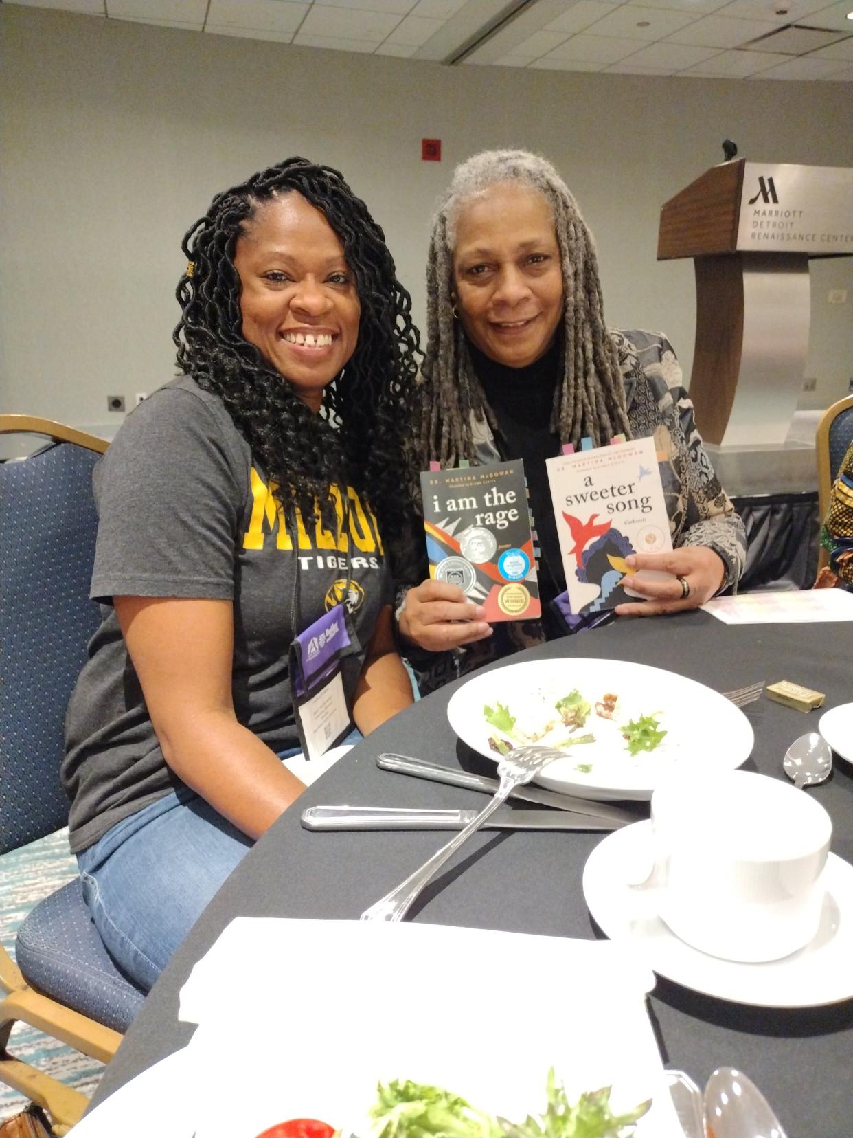 At this year's Heartland Fall Forum literary conference in Detroit, Black Tea Bookshop proprietor Candace Hulsizer (left) met with authors such as Martina McGowan.