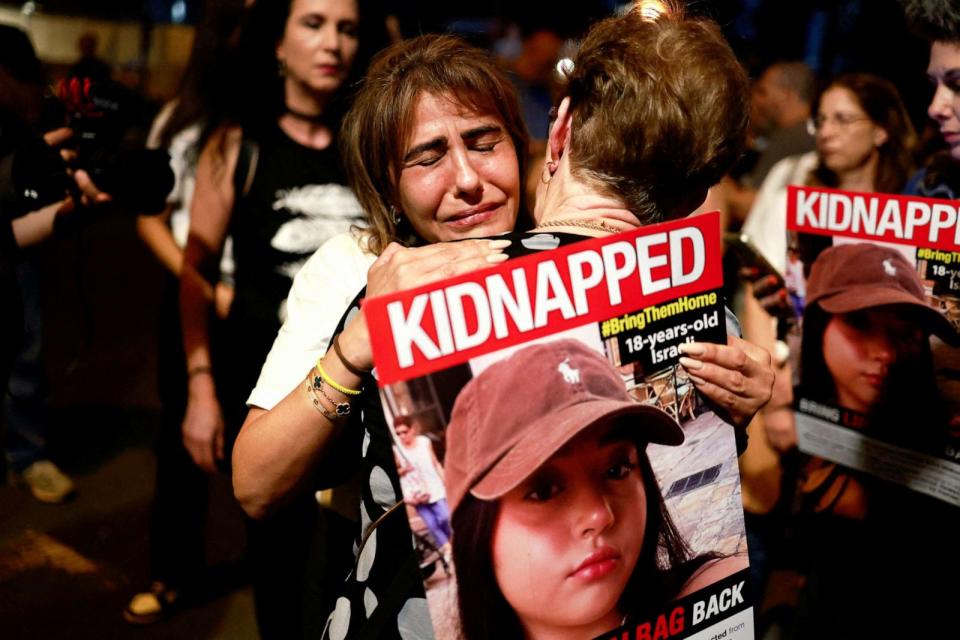 PHOTO: People react as residents of Tel Aviv show support and solidarity with the families of hostages who are being held in Gaza, amid the ongoing conflict between Israel and Hamas, in Tel Aviv, Israel, Oct. 21, 2023. (Ammar Awad/Reuters)