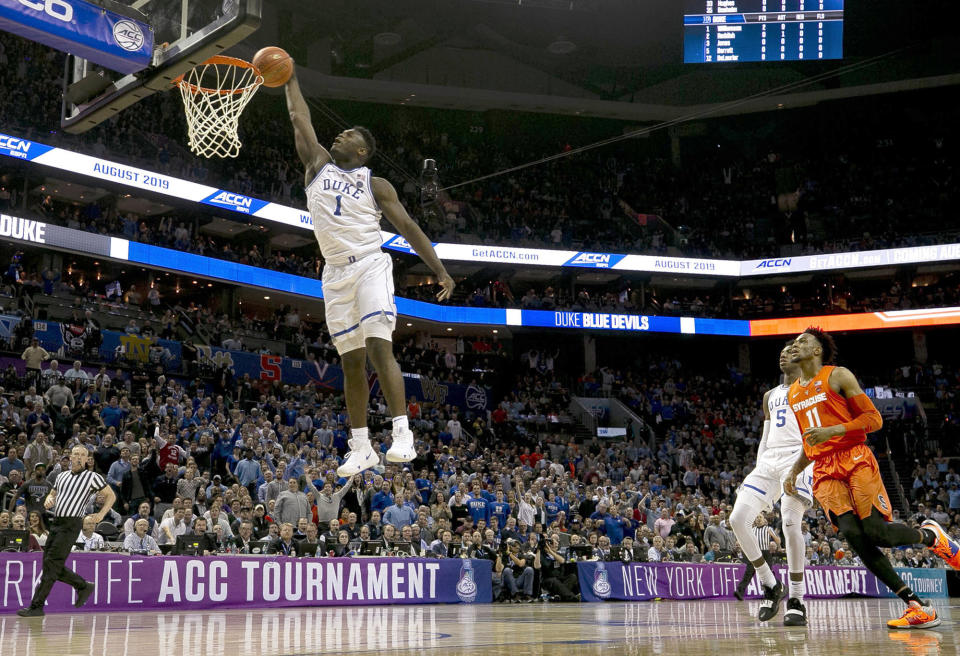 Duke's Zion Williamson (1) glides to the basket for a dunk in the opening minutes of play against Syracuse in the quarterfinals of the ACC Tournament at the Specturm Center in Charlotte, N.C., on Thursday, March 14, 2019. (Robert Willett/Raleigh News & Observer/TNS via Getty Images)