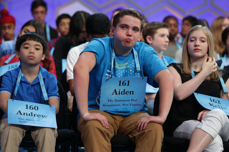 <p>Aiden Jeffrey Arnett (C) of Morgantown, West Virginia, waits on stage during round two of 2017 Scripps National Spelling Bee at Gaylord National Resort & Convention Center May 31, 2017 in National Harbor, Maryland. Close to 300 spellers are competing in the annual spelling contest for the top honor this year. (Alex Wong/Getty Images) </p>