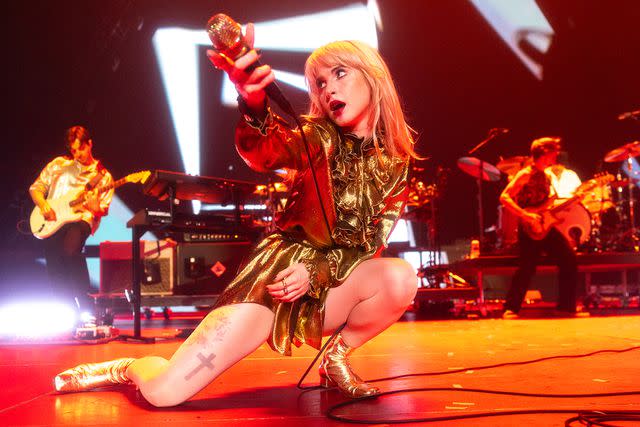 <p>Christopher Polk/Penske Media via Getty Images</p> Paramore performing in California in July 2023
