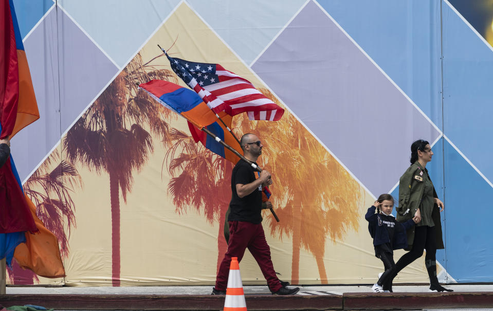 Armenian-American march to a rally against the Armenian genocide in Beverly Hills, Calif., Saturday, April 24, 2021. The systematic killing and deportation of more than a million Armenians by Ottoman Empire forces in the early 20th century was "genocide," the United States formally declared on Saturday, as President Joe Biden used that precise word after the White House had avoided it for decades for fear of alienating ally Turkey. (AP Photo/Damian Dovarganes)