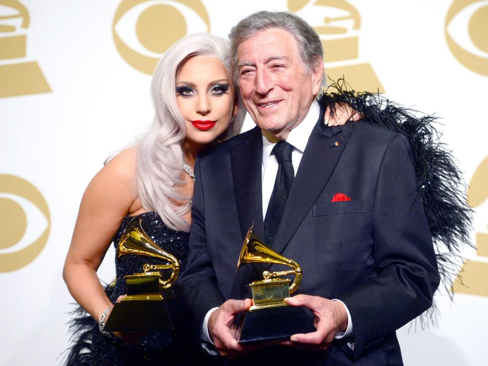 Singers Lady Gaga (L) and Tony Bennett, winners of Best Traditional Pop Vocal Album for 'Cheek to Cheek,' pose in the press room during The 57th Annual GRAMMY Awards at the STAPLES Center on February 8, 2015