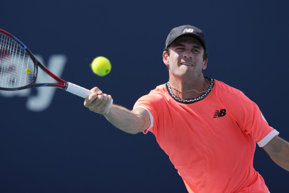 Tommy Paul returns to Alejandro Davidovich Fokina of Spain during the Miami Open tennis tournament, Sunday, March 26, 2023, in Miami Gardens, Fla. (AP Photo/Marta Lavandier)