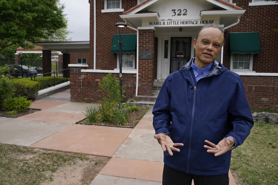 Tulsa historian Hannibal Johnson stands in front of the Mabel B. Little Historical House Tuesday, April 27, 2021, in the Greenwood area of Tulsa, Okla. After Oklahoma became a state, the first law approved was a Jim Crow statute requiring segregation of rail cars and depots. “Oklahoma, in many ways although arguably not a Southern state in terms of racial policy, began to mimic the Deep South," Johnson says. (AP Photo/Sue Ogrocki)