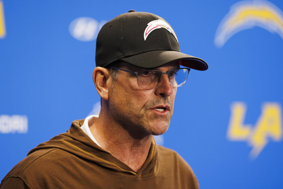 COSTA MESA, CALIFORNIA – JUNE 13: Jim Harbaugh of the Los Angeles Chargers on the podium before an NFL football practice at the Hoag Performance Center on June 13, 2024 in Costa Mesa, California. (Photo by Ric Tapia/Getty Images)